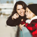 woman in black jacket smiling